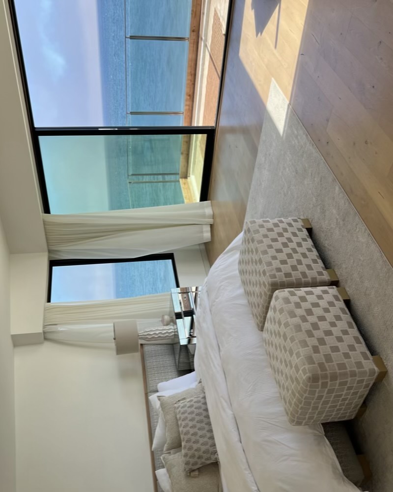 Primary bedroom suite opening to an ocean view