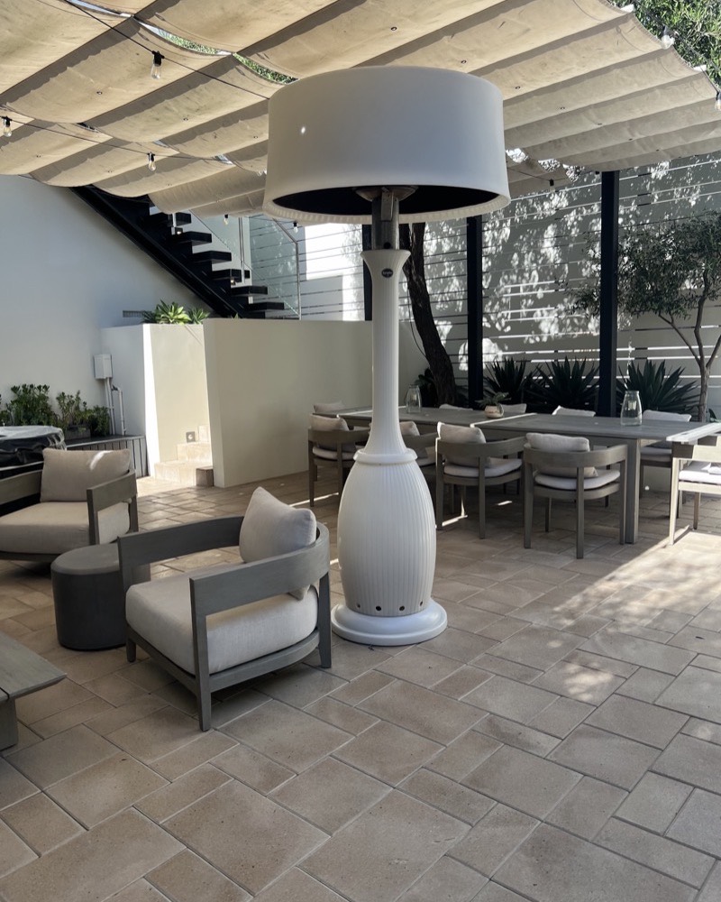 Covered outdoor terrace with lounge and dining areas